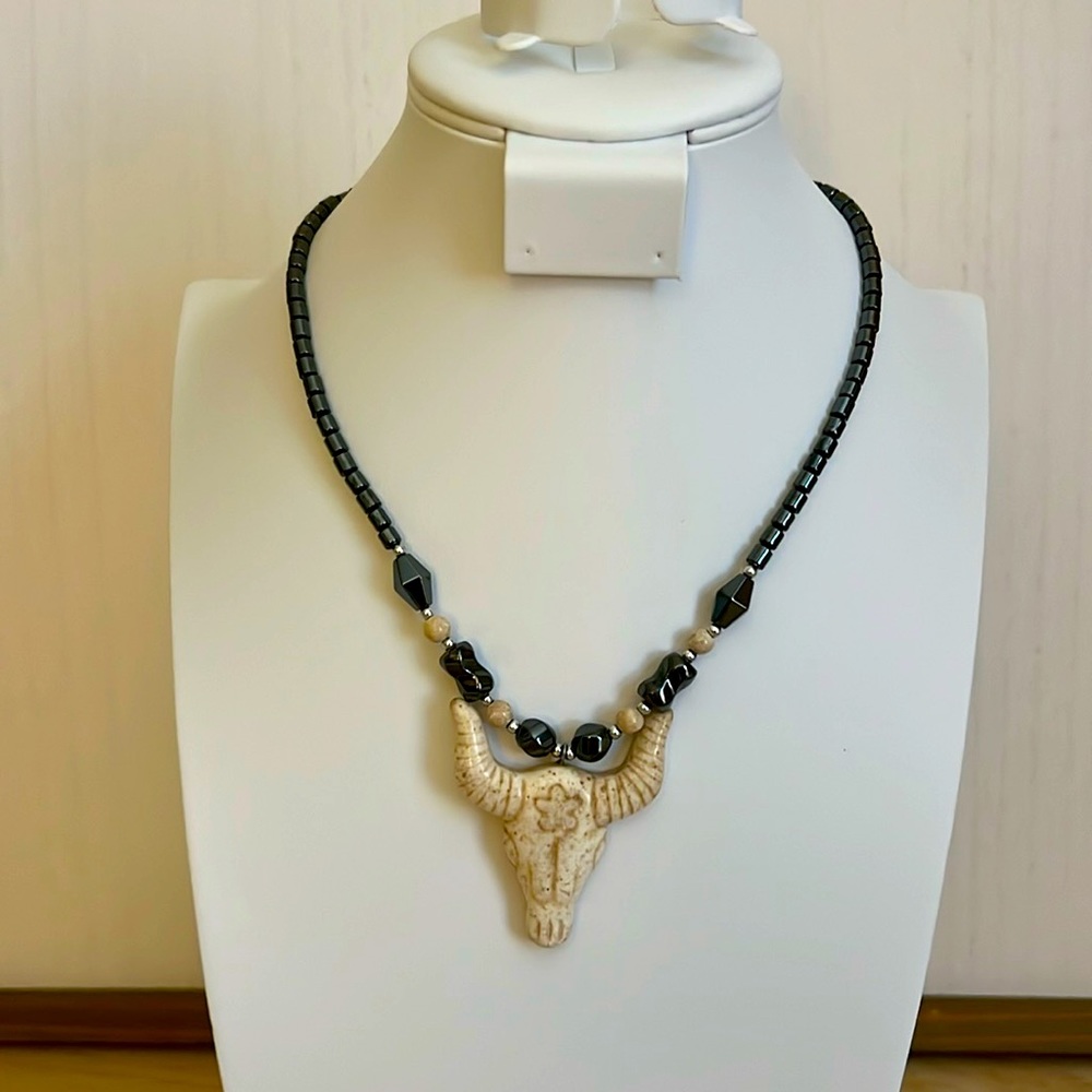 Hematite Beaded Necklace with bone colored steer head pendant.
